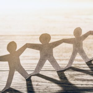 Team of paper chain people. Human chain with light and shadow.